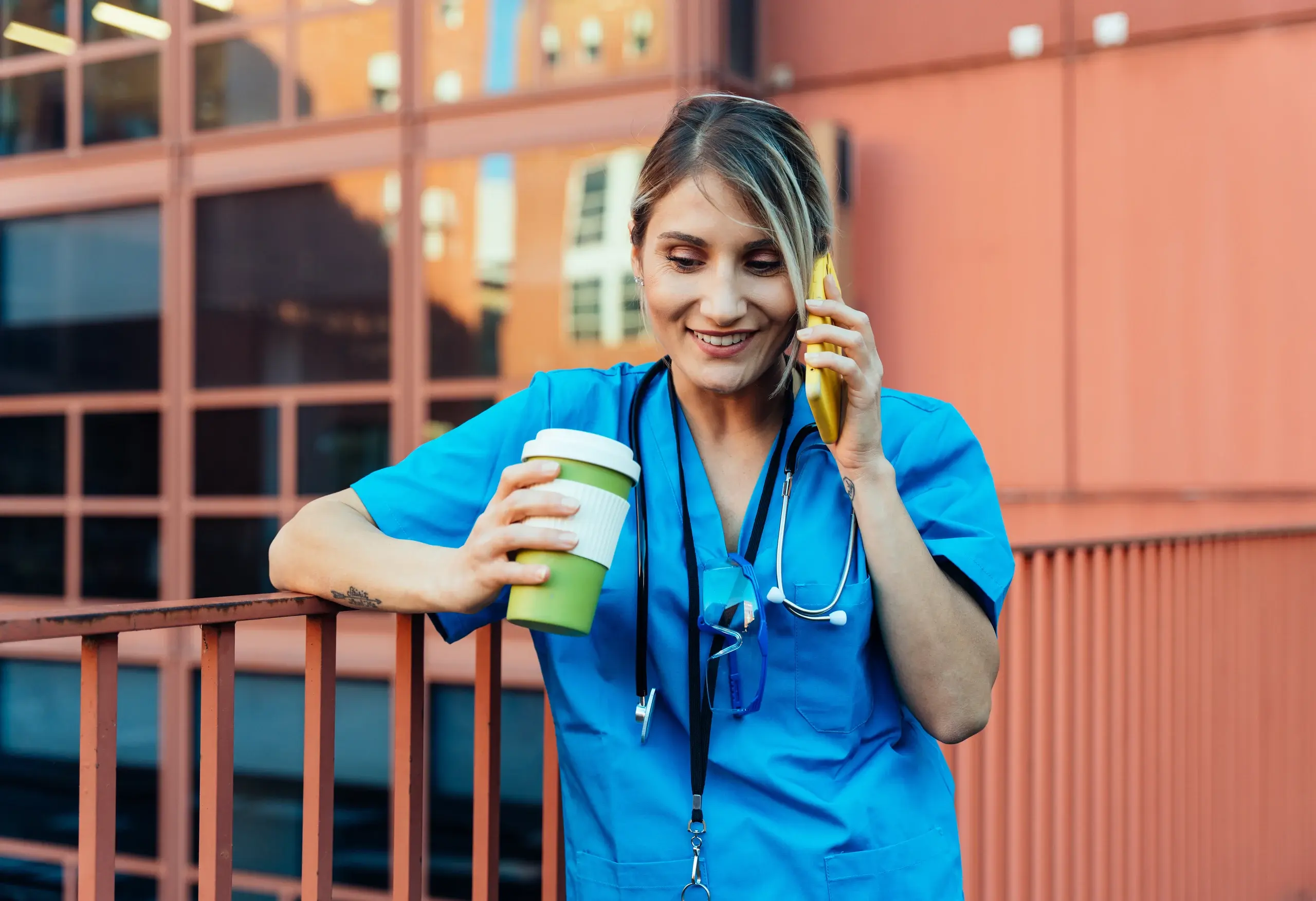 Clinician taking an on-call phone call outside a hospital