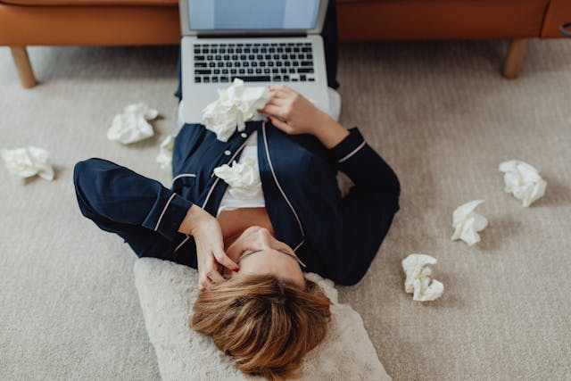 stressed schedule maker on laptop on floor