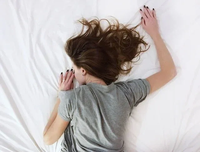 person sleeping in bed