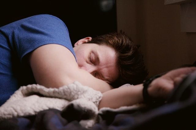 person sleeping recovering from burnout