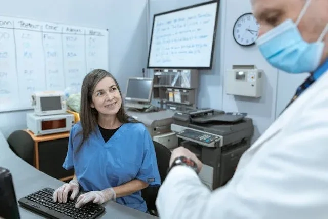 roster maker in a hospital discussing with dr