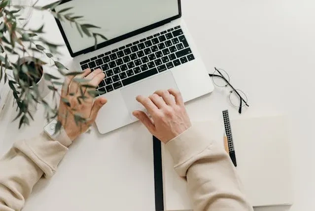 person on laptop scheduling