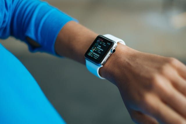 person looking at smart watch