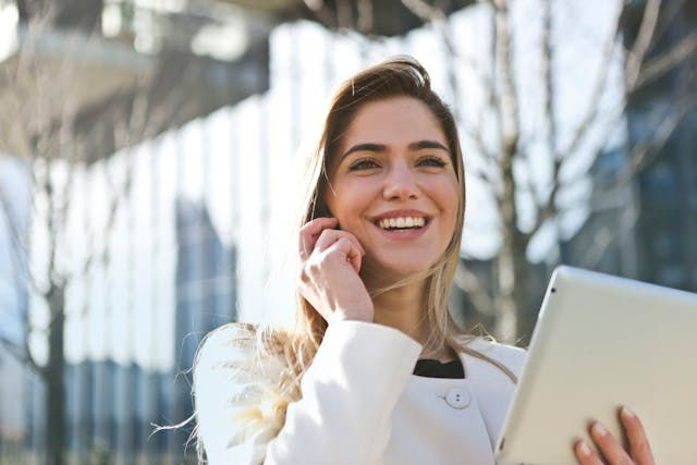 women happy on phone