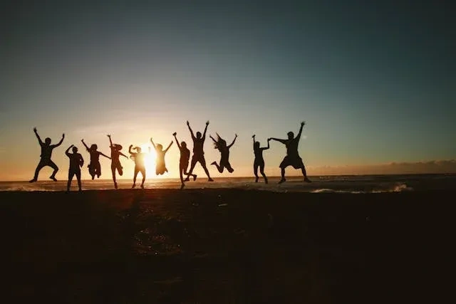 happy team culture jumping in air