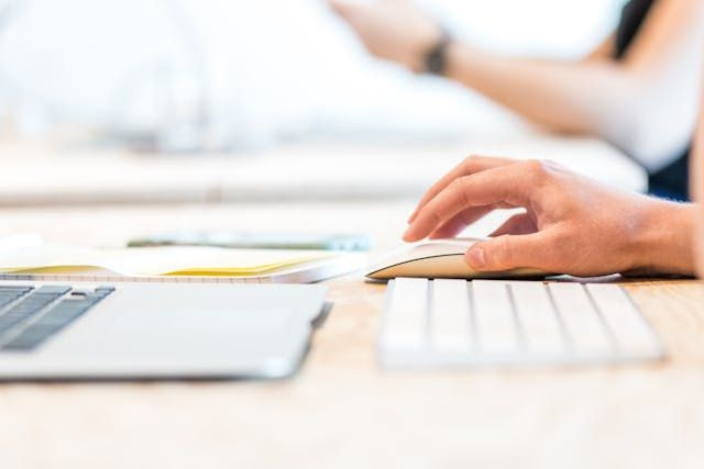 person scheduling split shift on laptop