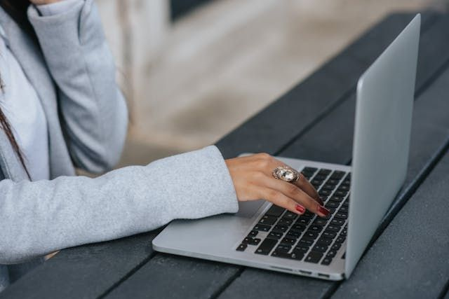 person scheduling shifts on a laptop
