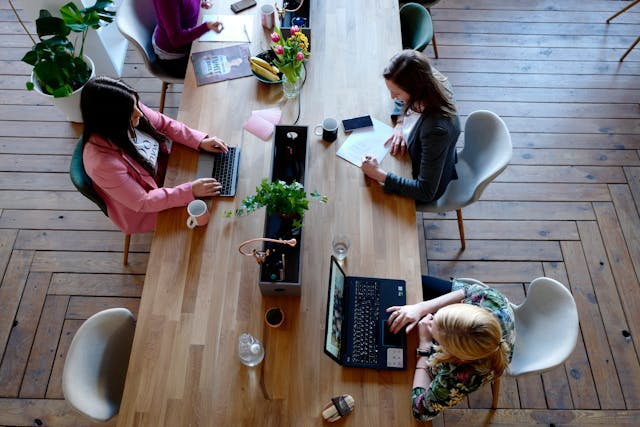 team at work on a long desk