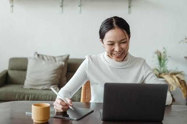 women on laptop working a shift