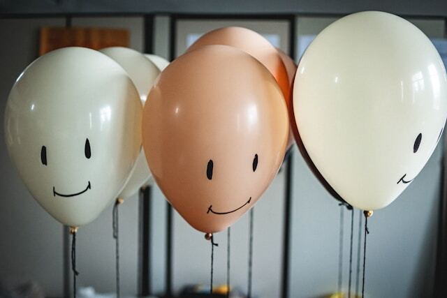 Balloons with smiley faces on them