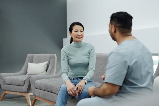one nurse and one employee talking