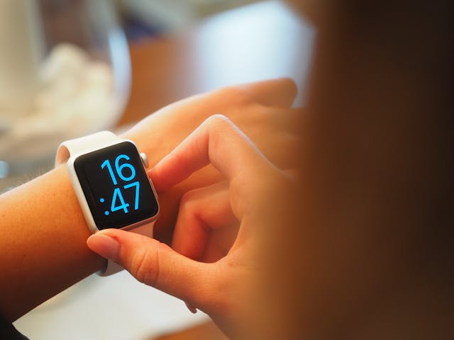 Employee checking the time on their digital watch