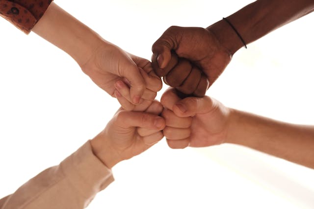 Team hands touching 