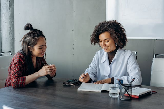 two co workers talking