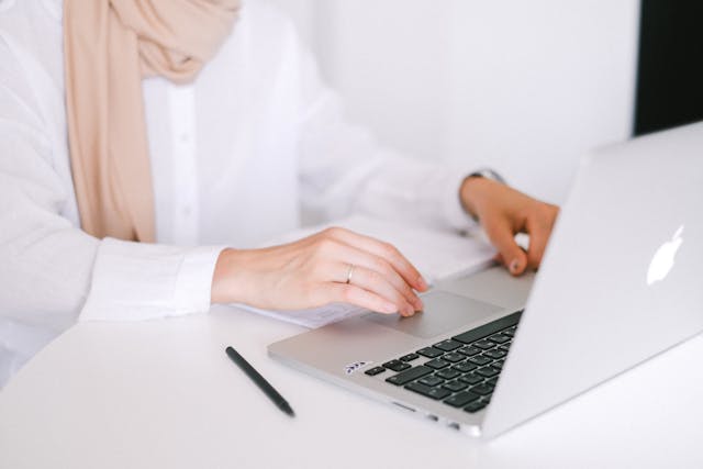Employee working on a laptop at their desk