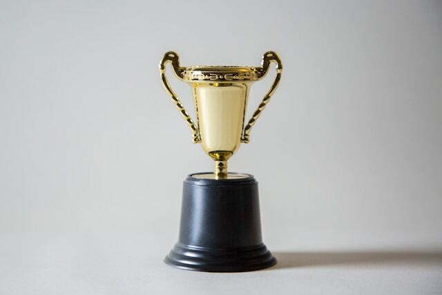 Rostering champion trophy gold